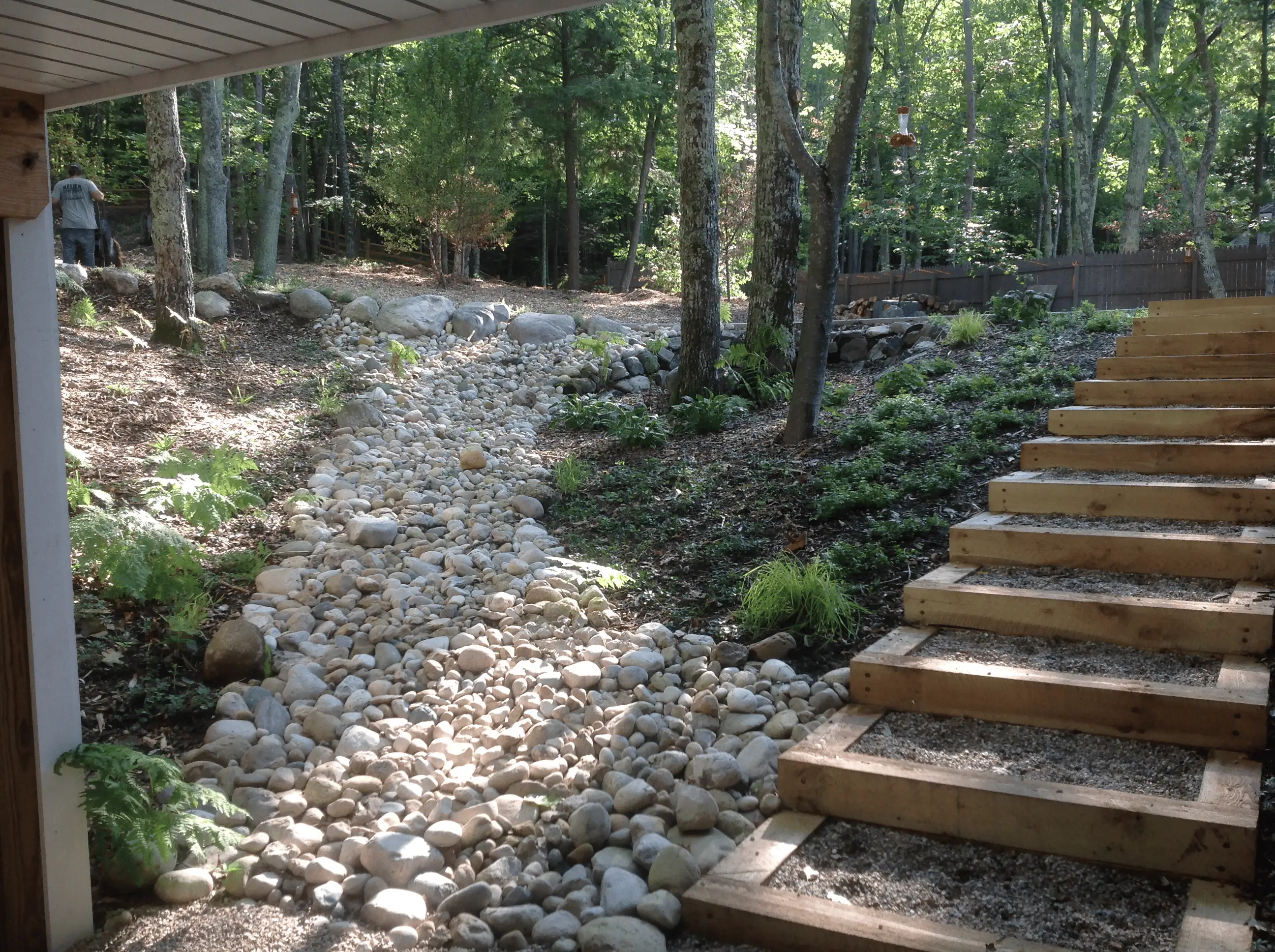 After: stone dry creekbed with integrated steps on the slope.